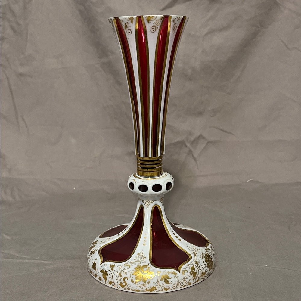This is an antique Bohemian overlay glass vase.